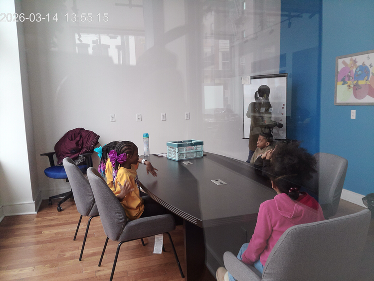 Students working around a table